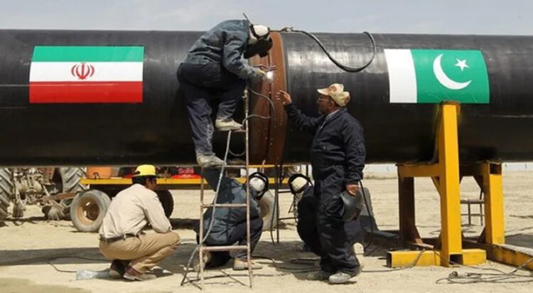 FILE Welders work on a pipeline to transfer natural gas from Iran to Pakistan, in Chabahar on March 11, 2013. — AFP
