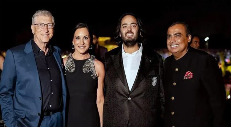 This photograph released by the Reliance group shows R to L, billionaire industrialist Mukesh Ambani, Anant Ambani, Paula Hurd, and Bill Gates posing for a photograph at a pre-wedding bash of Mukesh Ambani's son Anant in Jamnagar, India, Saturday, Mar. 02, 2024. (Reliance group via AP)