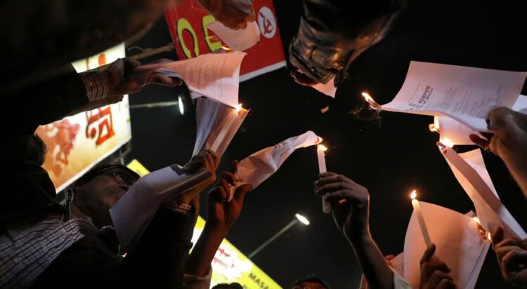 Demonstrators burn copies of Citizenship Amendment Act (CAA) during a protest in Kolkata, India, January 2, 2020. REUTERS/Rupak De Chowdhuri/File photo