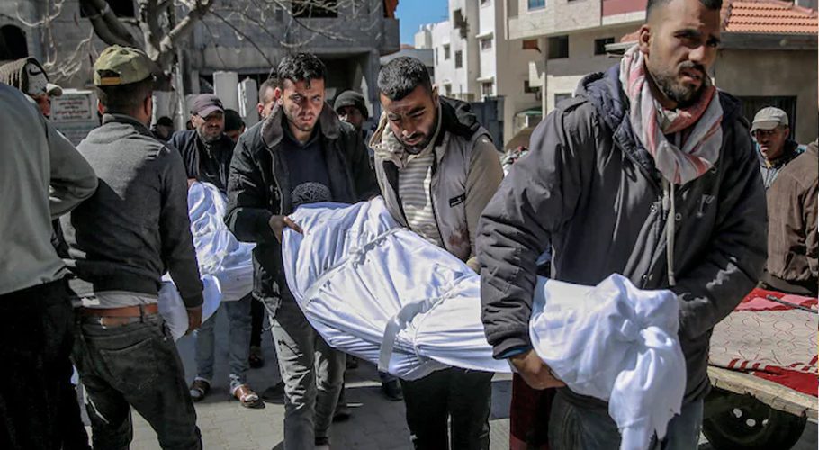 Men carry the bodies of people killed in an early-morning incident at an aid distribution point in Gaza City on Thursday. (AFP/Getty Images)