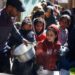 Palestinian children wait to receive food cooked by a charity kitchen amid famine, in Rafah, in the southern Gaza Strip on March 5, 2024 [Reuters/Mohammed Salem]