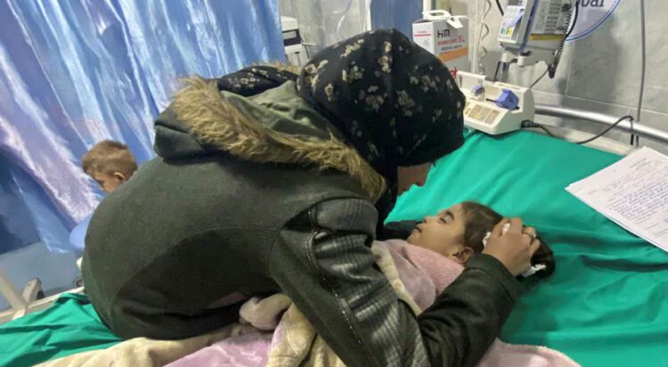 Palestinian mother Anwar Abdulnabi cries over the body of her daughter Mila, who had been suffering from deficiencies of calcium and potassium, at Kamal Adwan hospital on the edges of Beit Lahiya, in the northern Gaza Strip, March 2, 2024. REUTERS/Osama Abu Rbaya