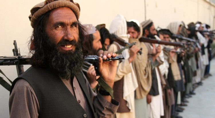 Taliban fighters in eastern Nangarhar Province attend a surrender ceremony in 2016. Rahman Safi/Xinhua via Getty Images