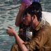 A Pakistani man cools down with water at a mosque during a heatwave in Karachi on June 22, 2015 (AFP Photo)