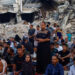 Palestinians hold Eid al-Adha prayers by the ruins of ar-Rahma Mosque destroyed by Israeli air strikes, in Khan Younis, in the southern Gaza Strip. [Mohammed Salem/Reuters]