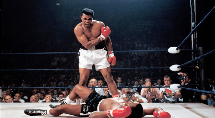 Muhammad Ali after first-round knockout of Sonny Liston in their second heavyweight title fight, in May 1965. Ali had taken the title from the heavily favored Liston 15 months before. (Neil Leifer / Sports Illustrated / Getty Images)