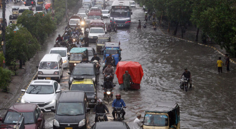 file photo of monsoon rain, urban flood in Karachi