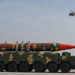 Pakistani military helicopters fly past a vehicle carrying a long-range ballistic Shaheen III missile take part in a military parade to mark Pakistan's National Day in Islamabad on March 25, 2021. (AFP/File)