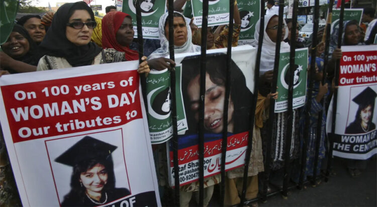 FILE/ People rally demanding the release of Aafia Siddiqui, who was convicted in February 2010 of two counts of attempted murder. The man who authorities say was holding hostages inside a Texas synagogue on Saturday, Jan. 15, 2022, demanded her release.Fareed Khan/The Associated Press