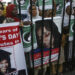 FILE/ People rally demanding the release of Aafia Siddiqui, who was convicted in February 2010 of two counts of attempted murder. The man who authorities say was holding hostages inside a Texas synagogue on Saturday, Jan. 15, 2022, demanded her release.Fareed Khan/The Associated Press