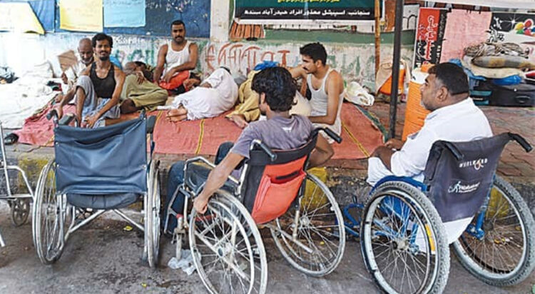 A group of people on wheelchairs are seen in this file photo. — White Star/File