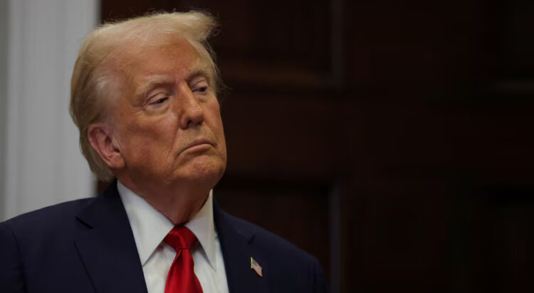 U.S. President Donald Trump stands after delivering remarks on AI infrastructure at the Roosevelt room at White House in Washington, U.S., January 21, 2025. REUTERS/Carlos Barria