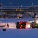 Emergency responders operate around a plane on a runway after a plane crash at Toronto Pearson International Airport in Mississauga, Ontario, Canada February 17, 2025. REUTERS/Cole Burston