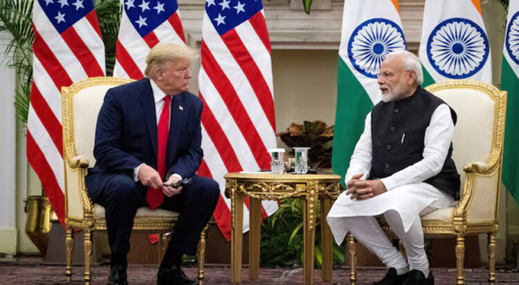 Indian Prime Minister Narendra Modi speaks to U.S. President Donald Trump during a meeting at Hyderabad House in New Delhi, India, February 25, 2020. REUTERS/Al Drago/File Photo