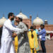 Muslims hug eachother after offering Eid al-Fitr prayers at the Badshahi Mosque in Lahore on May 24, 2020. (AFP/File)