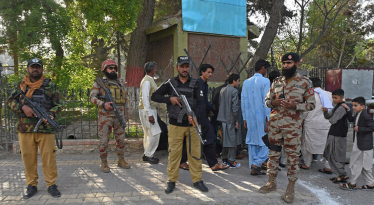 File/ Security personnel stand guard in Quetta on April 10, 2024. (AFP/File)a