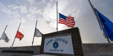 In this photo reviewed by US military officials, flags fly at half-staff at Camp Justice in Guantanamo Bay Naval Base in Cuba on Aug. 29, 2021. (AP/File)