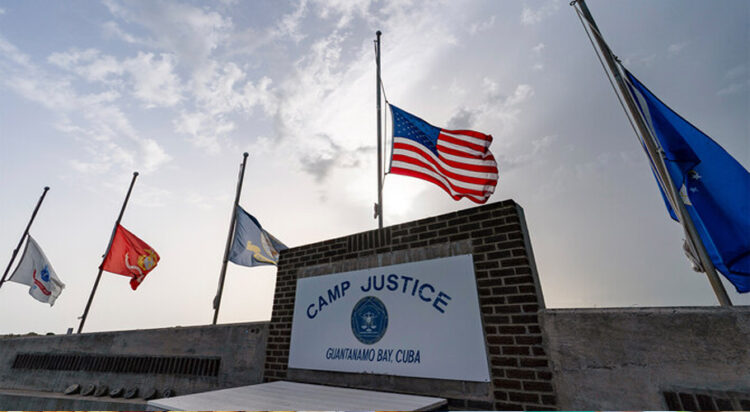 In this photo reviewed by US military officials, flags fly at half-staff at Camp Justice in Guantanamo Bay Naval Base in Cuba on Aug. 29, 2021. (AP/File)