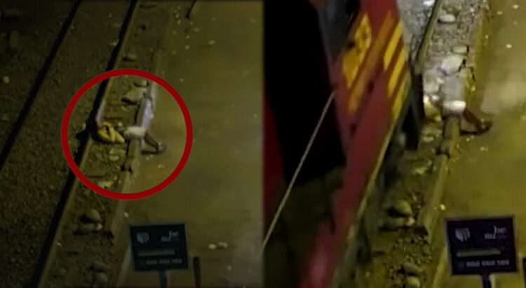 A man has survived being run over by a train while sleeping by train tracks in Peru (Screengrab)