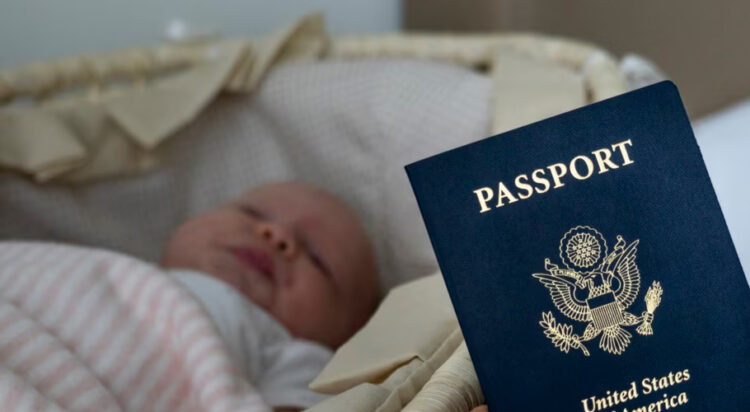 In this photo taken on Jan. 24, 2019, Denis Wolok, the father of 1-month-old Eva, shows the child's U.S. passport during an interview with The Associated Press in Hollywood, Fla.