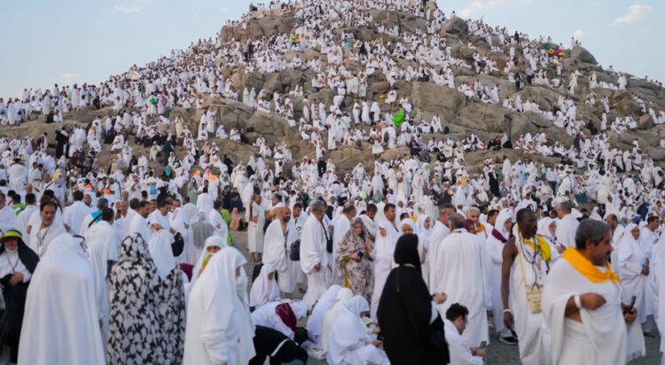 Muslim pilgrims gather at the top of the rocky hill known as the Mountain of Mercy, on the Plain of Arafat, during the annual Hajj pilgrimage, near the holy city of Mecca, Saudi Arabia. [Rafiq Maqbool/AP Photo]