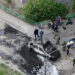 Law enforcement officers work at the site of a car bomb, which killed senior Russian military officer, in Balashikha, outside Moscow, Russia April 25, 2025. REUTERS/Yulia Morozova