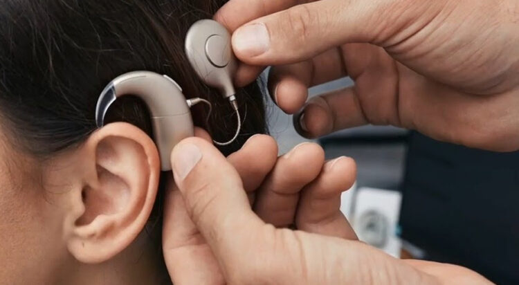 A cochlear implant is a small, complex electronic device that can help to provide a sense of sound to a person who is profoundly deaf or severely hard-of-hearing. (File)