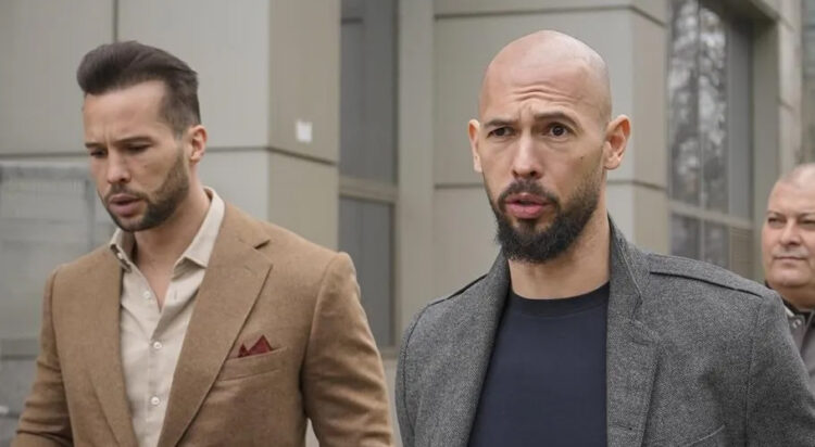 FILE - Andrew Tate, right, and his brother Tristan leave the tribunal in Bucharest, Romania, Thursday, Feb. 29, 2024. Vadim Ghirda / The Associated Press