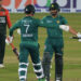 Pakistan´s Mohammad Nawaz (R) and Shadab Khan (C) celebrate their win in the first Twenty20 international cricket match between Bangladesh and Pakistan at the Sher-e-Bangla National Cricket Stadium in Dhaka on November 19, 2021. — AFP