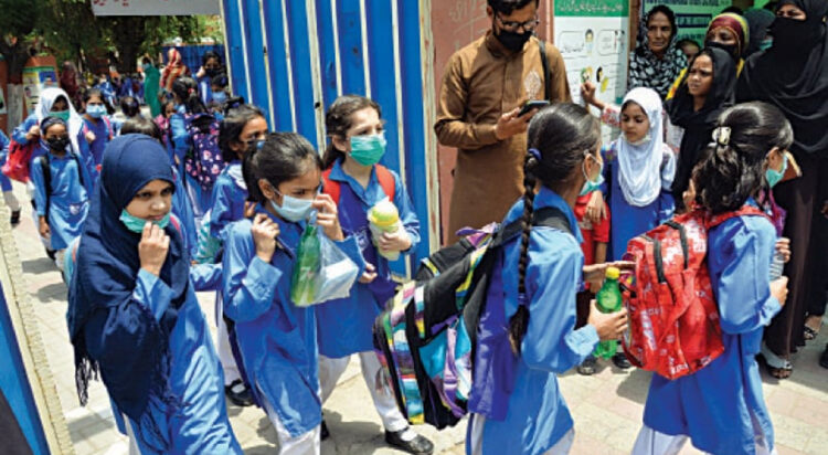 This undated file photo shows students coming out of Govt Kinnaird High School at Boharwala Chowk after reopening of the educational institutions, which were closed due to Covid pandemic. (Credit: White Star)