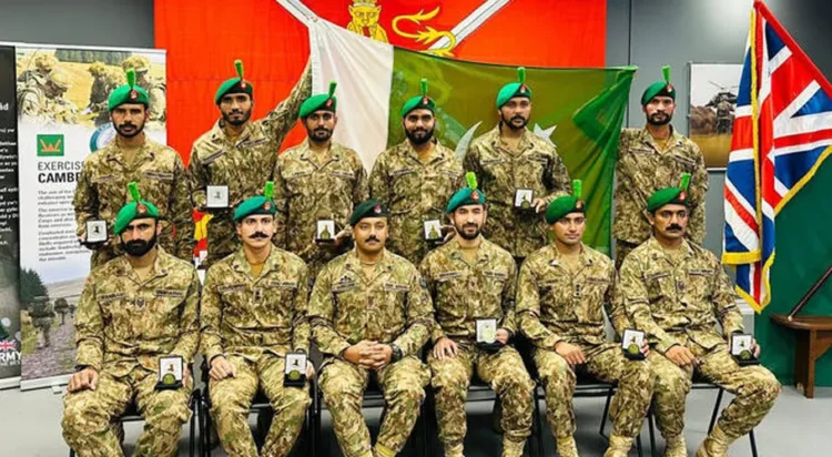 The picture shared on October 13, 2025, shows Pakistani soldiers posing for a picture after winning a gold medal in Exercise Cambrian Patrol - 2025 in Wales, UK. (Pakistan Army)