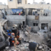 Palestinians work to recover the body of Fathi Oweida from under the rubble of a house hit in an overnight Israeli strike, in Gaza City, October 29, 2025. REUTERS/Dawoud Abu Alkas