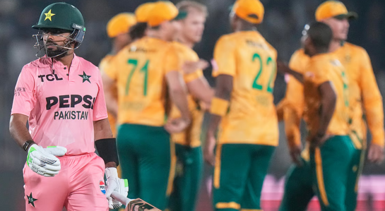Pakistan's Babar Azam, left, walks off the field as South African players celebrates after his dismissal during the first T20 cricket match between Pakistan and South Africa, in Rawalpindi, Pakistan, Tuesday, Oct. 28, 2025 AP Photo/Anjum Naveed