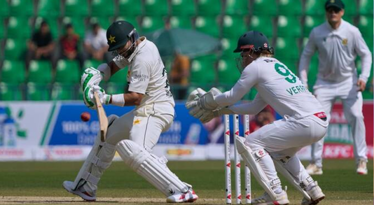 Pakistan's Imam-ul-Haq, left, plays a shot during the first day of of first test cricket match between Pakistan and South Africa, in Lahore, Pakistan, Sunday, Oct. 12, 2025. (AP)