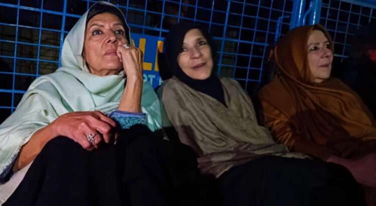 PTI founder and former prime minister Imran Khan — Aleema Khan, Uzma Khan and Noreen Khan Niazi sitting outside Adiala Prison (File)