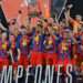 Football - Spanish Super Cup - Final - FC Barcelona v Real Madrid - King Abdullah Sports City Stadium, Jeddah, Saudi Arabia - January 12, 2026 FC Barcelona's Ronald Araujo lifts the trophy with teammates after winning the Spanish Super Cup final REUTERS/Stringer
