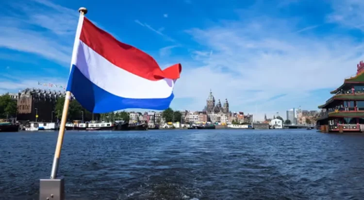 The Dutch tricolor flag over Amsterdam, the capital of Netherlands. (Image: mappr.co)