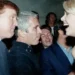 This undated photo from the personal collection of Jeffrey Epstein provided by the Democrats on the House Oversight Committee on December 12, 2025, shows US President Donald Trump (L), flanked by Epstein (C), talking to an unknown woman. — AFP/File