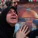 A woman reacts as people gather at the Enghelab Square, after Iran's Supreme Leader Ayatollah Ali Khamenei was killed in Israeli and U.S. strikes on Saturday, in Tehran, Iran, March 1, 2026. Majid Asgaripour/WANA (West Asia News Agency) via REUTERS