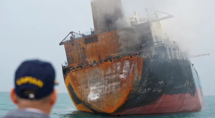A foreign tanker carrying Iraqi fuel oil damaged after catching fire in Iraq's territorial waters, following unidentified attacks that targeted two foreign tankers, according to Iraqi port officials, near Basra, Iraq, March 12, 2026. REUTERS/Mohammed Aty