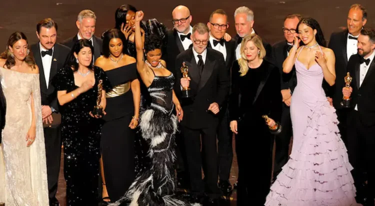 Director Paul Thomas Anderson and cast members celebrate as they accept the Oscar for Best Picture for "One Battle after Another". REUTERS/Mike Blake