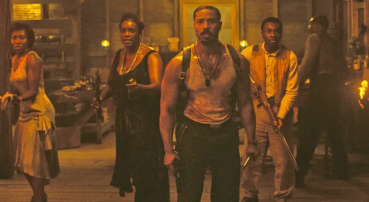 This image released by Warner Bros Pictures shows Michael B. Jordan, center, in a scene from “Sinners.” (Warner Bros. Pictures via AP)