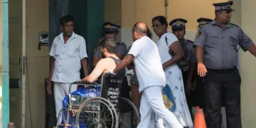 An injured person moves on a wheelchair at the National Hospital Galle where he will receive treatment after a submarine attack on an Iranian ship off Sri Lanka, in Galle, Sri Lanka, March 4, 2026. REUTERS/Thilina Kaluthotage