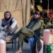 Pakistani men selling petrol wait for customers at their stall in the Pakistan–Iran border town of Taftan, Balochistan province on March 4, 2026. (AFP)