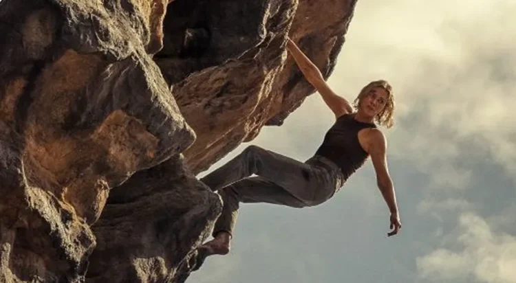 Theron plays Sasha, a grieving rock climber who travels to the Australian wilderness for isolation, only to be hunted by a ruthless serial killer played by Taron Egerton. Credit : Kane Skennar/Netflix