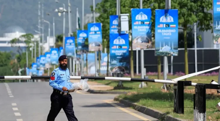 A police officer walks on the premises of the Serena Hotel, as Pakistan prepares to host the US and Iran for the second phase of peace talks in Islamabad, Pakistan, April 21, 2026. — AFP