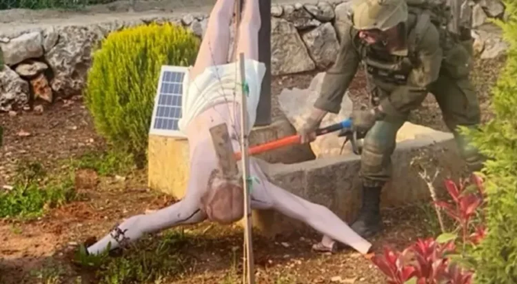 The Israel Defense Forces confirmed that a photo circulating online shows one of its soldiers smashing a statue of Jesus with a sledgehammer in the Christian-majority village of Debel, southern Lebanon. (Image: X)