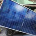 Men load solar panels on a rickshaw at a market in Karachi, Pakistan, on March 26. | REUTERS