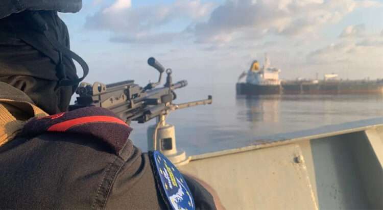 This undated file photo shows a Somali pirate firing at a tanker. (Image; EU NAVFOR)