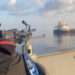 This undated file photo shows a Somali pirate firing at a tanker. (Image; EU NAVFOR)